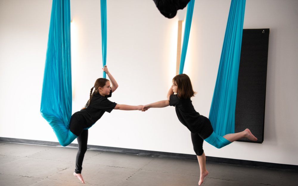 Sea Horse Aerial Yoga Partner Pose